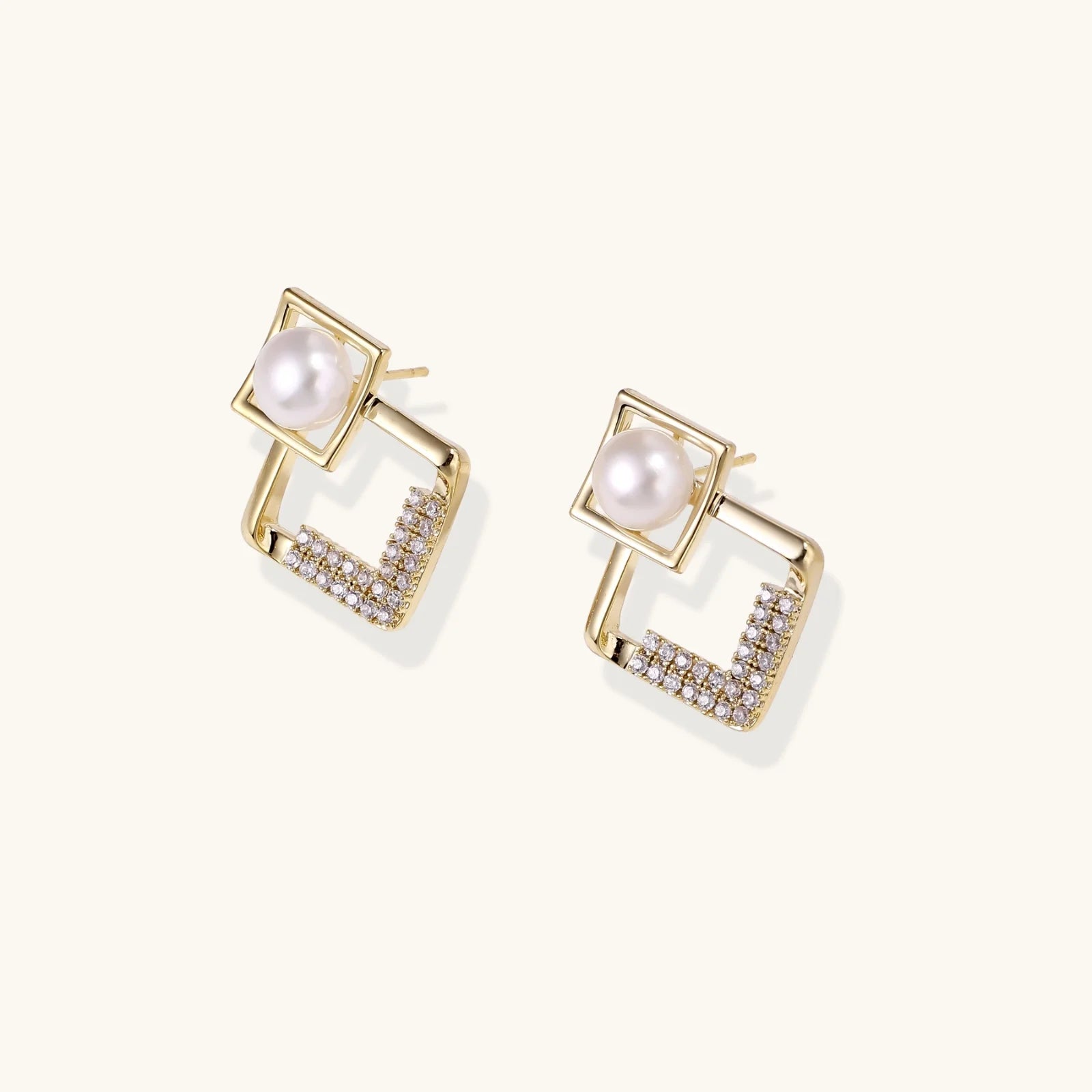 Gold-plated double square frame earrings with freshwater pearl and crystal accents on white background