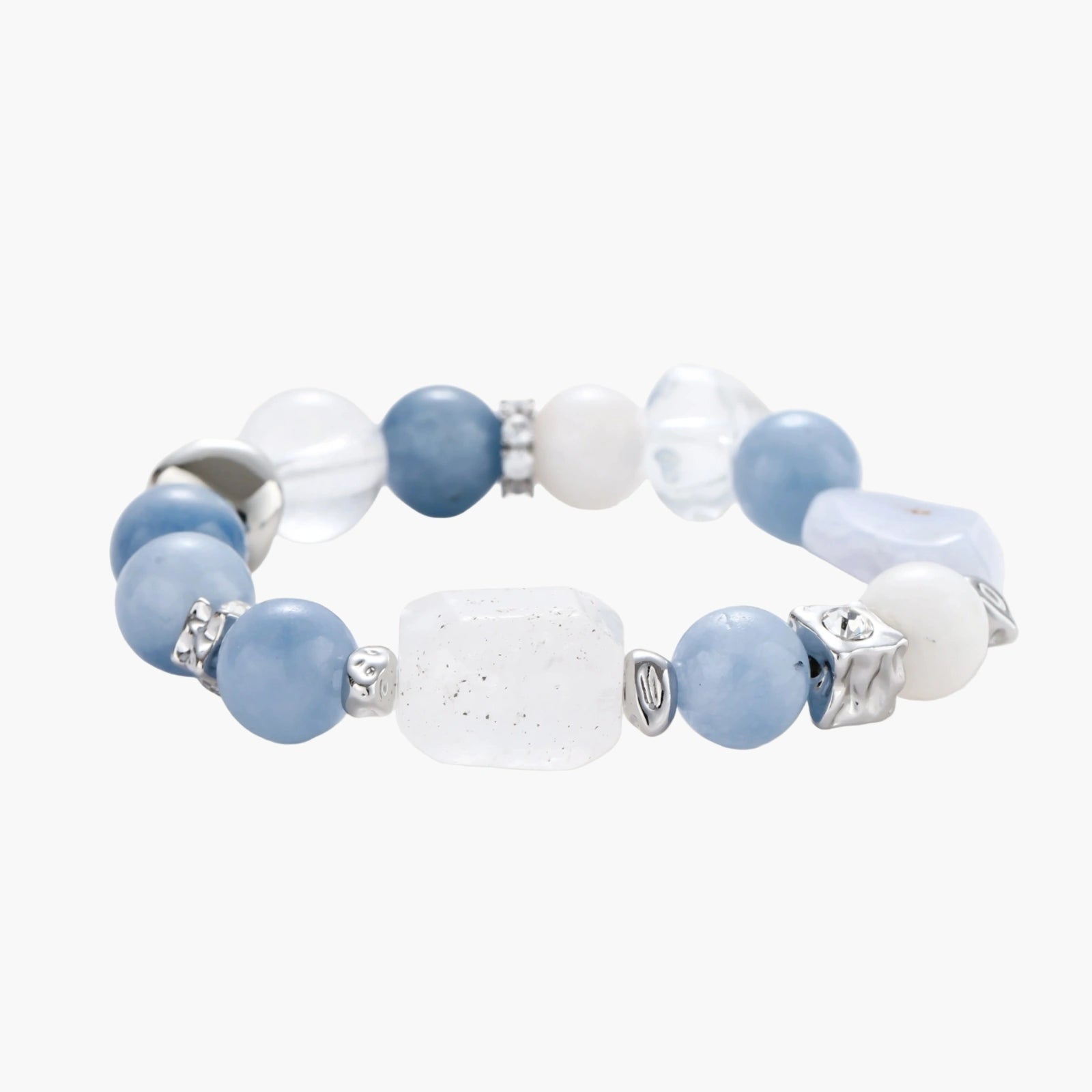 Stretchable bracelet with blue aquamarine beads, clear quartz crystals and copper accents on white background.